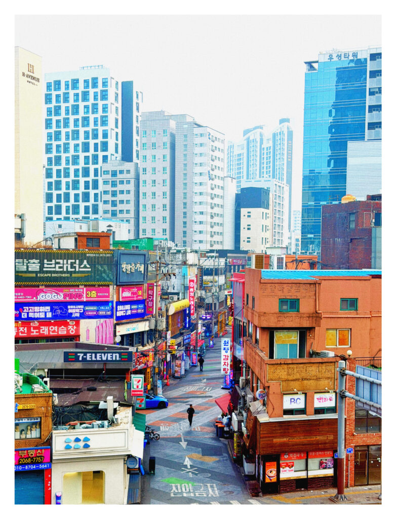 A colorful alley in Seoul South Korea, high rises in the background